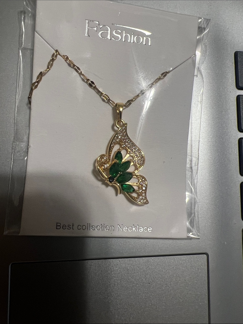 Gold Butterfly Necklace with Green Stones